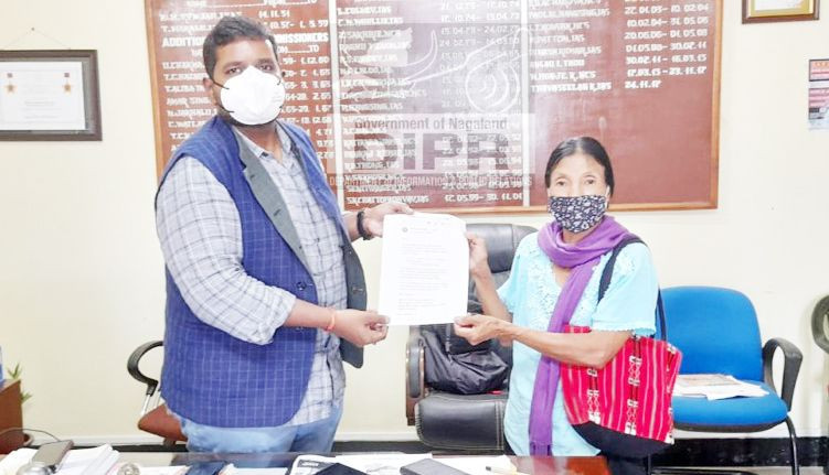 The DC, Mon handing over a letter intimating sanction of Rs 50 lakh under the the ‘Pradhan Mantri Garib Kalyan Package: Insurance Scheme for Health Workers Fighting COVID-19.’ (DIPR Photo)